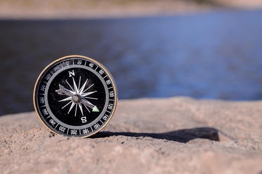 Compass on a rock photo
