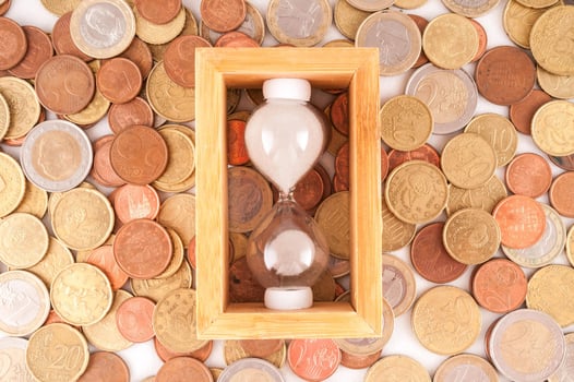 Hourglass and coins photo