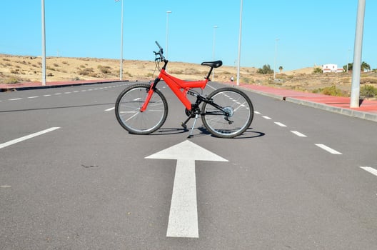 Red bicycle on the road photo