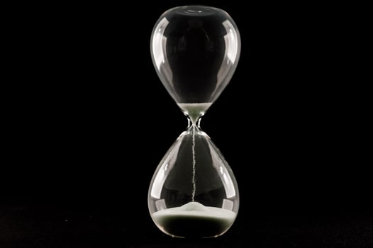 Isolated hourglass with dark background photo