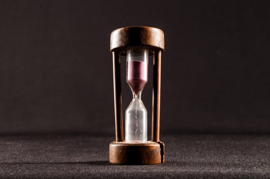 Isolated hourglass with dark background photo