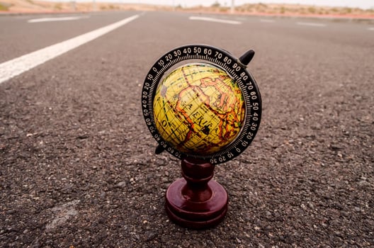 Globe on the road photo