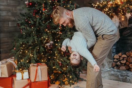 Dad holds his son in his arms and have fun together photo