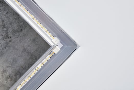 Strip LED light with square aluminum profile on stretch ceiling, close up. Home renovation concept photo
