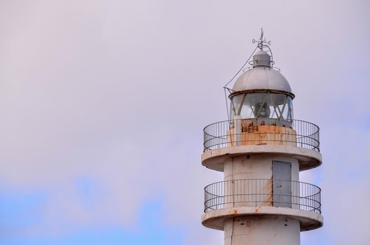 Lighthouse by the sea photo