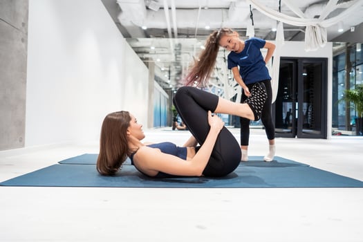 Mom and daughter do stretching before exercise photo