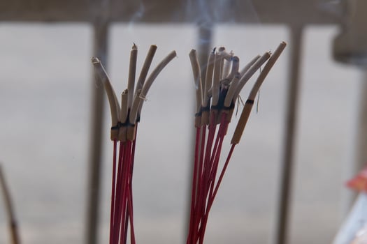 Incense stick and smoke from incense burning. photo