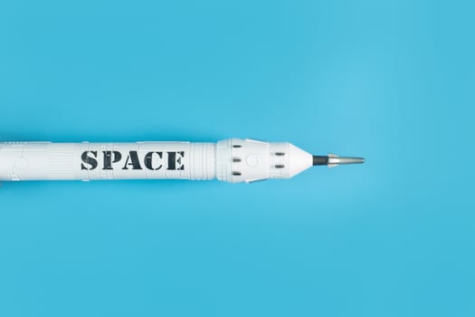 The  close up image space ship on blue background. photo