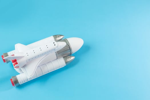 The  close up image space ship on blue background. photo