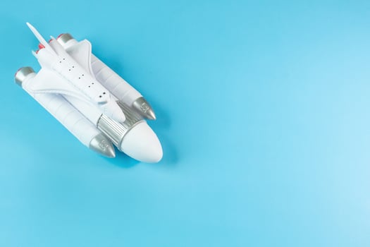 The  close up image space ship on blue background. photo