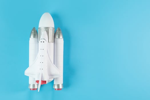The  close up image space ship on blue background. photo