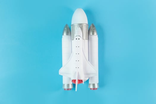 The  close up image space ship on blue background. photo