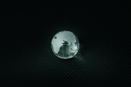 glass ball planet earth in black background. photo