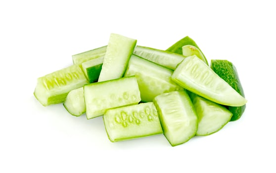 chopped cucumber isolated on white background photo