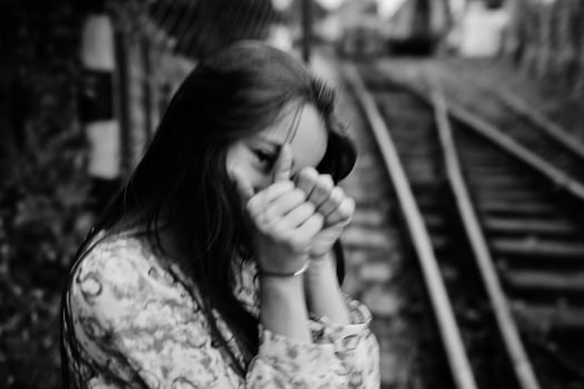 Lifestyle portrait of young girl posing on train station. photo