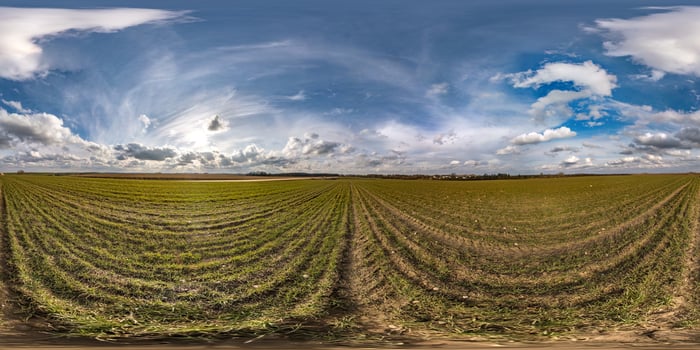 full seamless spherical hdri panorama 360 degrees angle view on among fields in spring day with awesome clouds in equirectangular projection, ready for VR AR virtual reality content photo