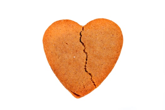 Biscuit like a broken heart shape, isolated on white background photo