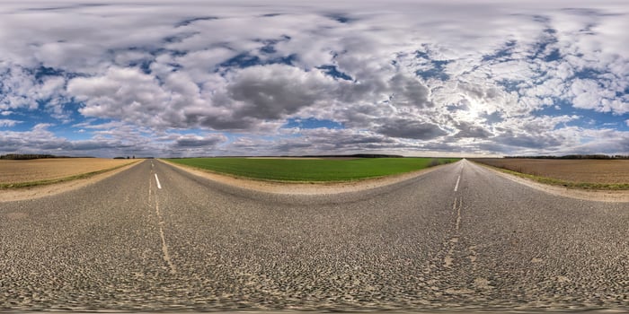 Full spherical seamless hdri panorama 360 degrees angle view on no traffic asphalt road among fields in evening with cloudy sky. 360 panorama in equirectangular projection, VR AR content photo