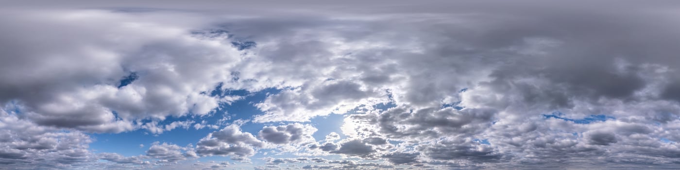 Seamless hdri panorama 360 degrees angle view blue sky with beautiful evening fluffy cumulus clouds without ground for use in 3d graphics or game development as sky dome or edit drone shot photo