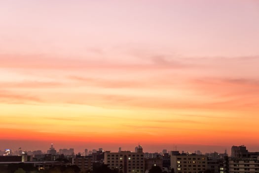 Twilight sunset at city with building silhouette. photo