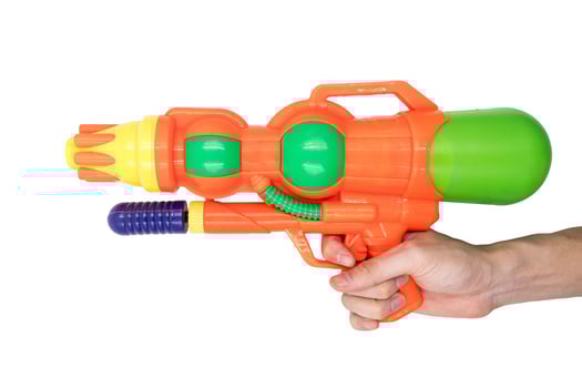Hands holding gun water toy on white background. photo