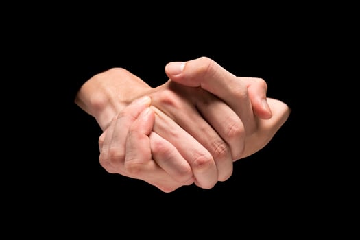 Male hands on a black background. photo