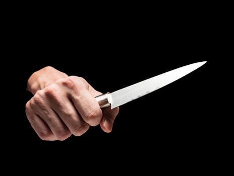 Male hand holding knife on black background. photo