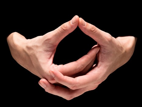 Male hands on a black background. photo