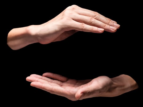 Male hands on a black background. photo