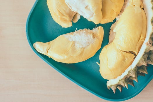 King of fruits, Top view of Durian on blue plate. photo
