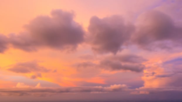 Dramatic sunset sky with clouds. Blur or defocus image. photo