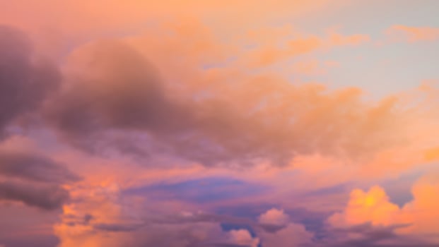 Dramatic sunset sky with clouds. Blur or defocus image. photo