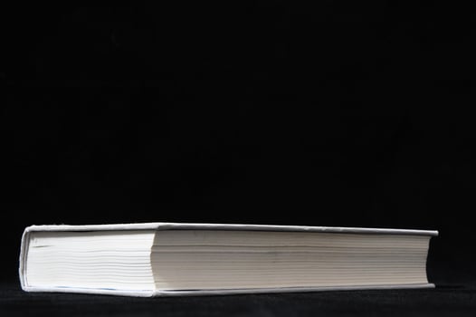 a book on a black background photo