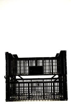 a black plastic crate with a white background photo
