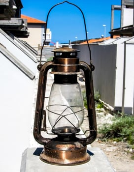 an old fashioned lantern on a roof photo