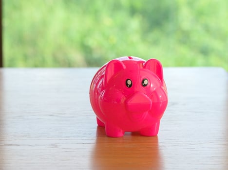 piggy bank on table with space photo