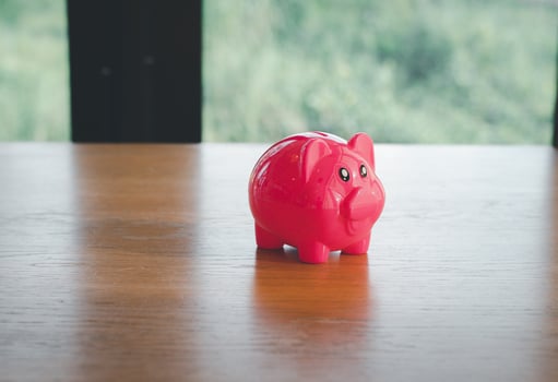 piggy bank on table with space photo