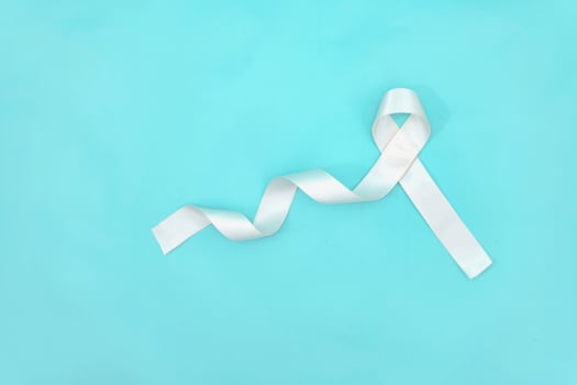 lung cancer awareness month with white ribbon. Healthcare and medicine concept. photo