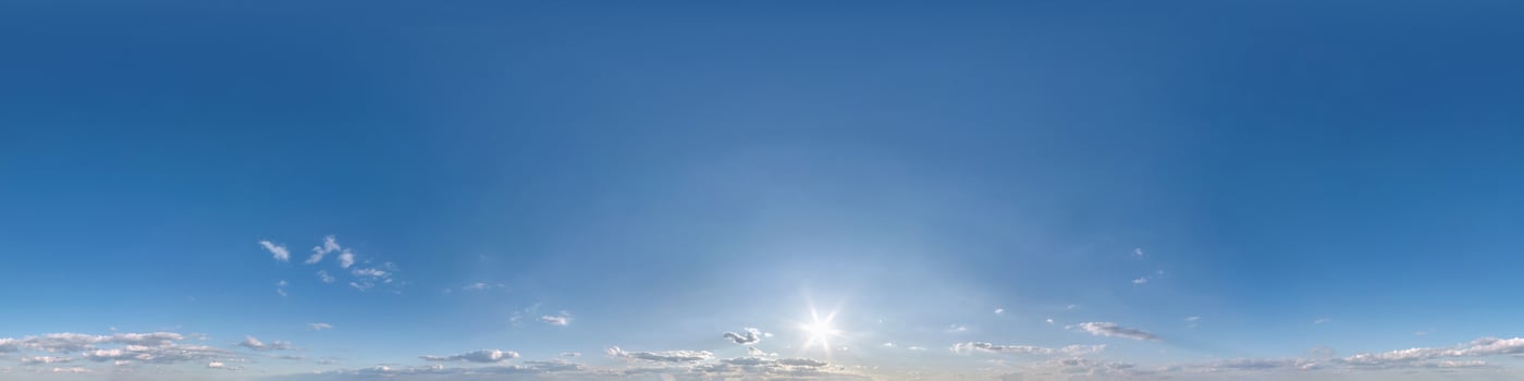 blue sky with beautiful fluffy cumulus clouds. Seamless hdri panorama 360 degrees angle view without ground for use in 3d graphics or game development as sky dome or edit drone shot photo