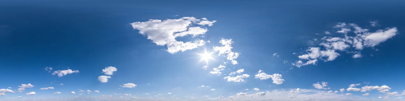 blue sky with beautiful fluffy cumulus clouds. Seamless hdri panorama 360 degrees angle view without ground for use in 3d graphics or game development as sky dome or edit drone shot photo
