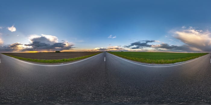 Full spherical hdri seamless panorama 360 degrees angle view on wet no traffic asphalt road among fields in evening  after storm with cloudy sky in equirectangular projection, VR AR content photo