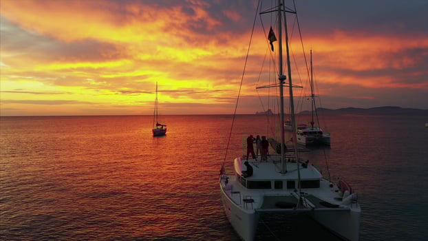 Aerial view from drone on boats shipping in sea, sunset photo