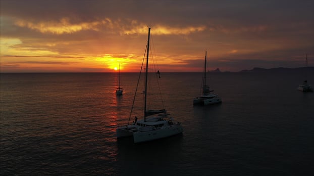 Aerial view from drone on boats shipping in sea, sunset photo