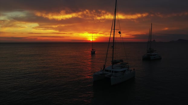 Aerial view from drone on boats shipping in sea, sunset photo