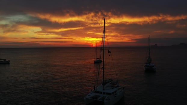Aerial view from drone on boats shipping in sea, sunset photo