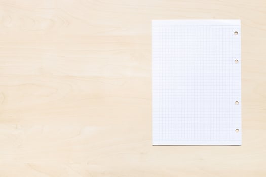 squared paper on light brown board with copyspace photo
