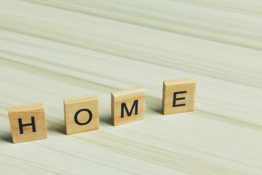 Home word on wood plate abstract background. photo