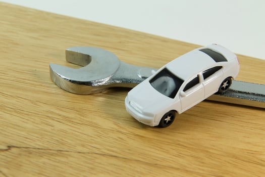 white car toy on wood table  image close up. photo