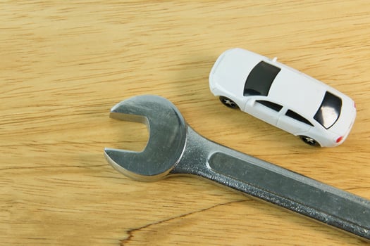 white car toy on wood table  image close up. photo