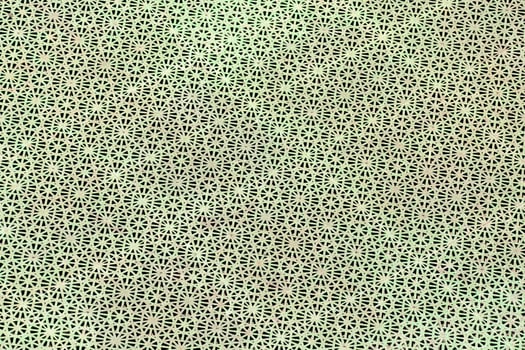 a green and white patterned fabric with small squares photo